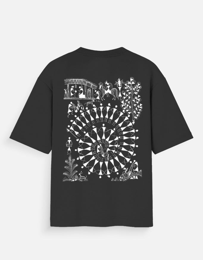 Back_Tribal Spiral Warli Art oversized graphic T-shirt by SWARNAMANTRA inspired by Indian tribal artwork and modern streetwear fashion.